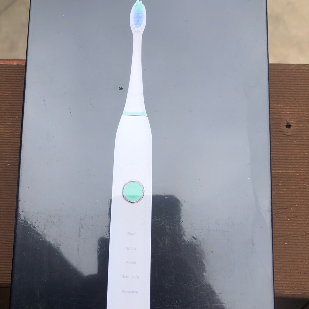 Electric tooth brush sealed and packaged